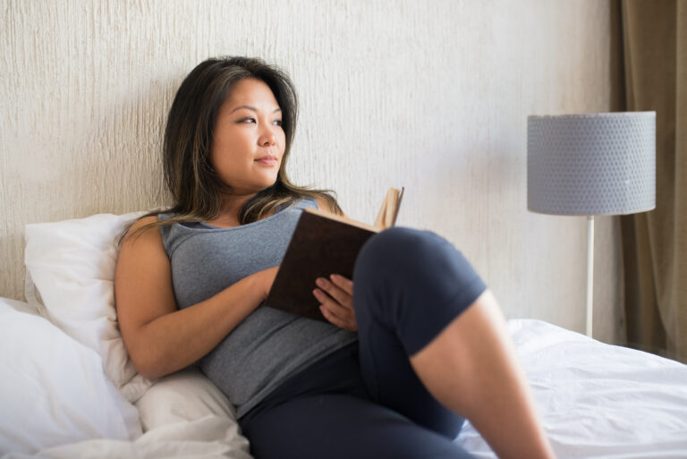woman reading in bed