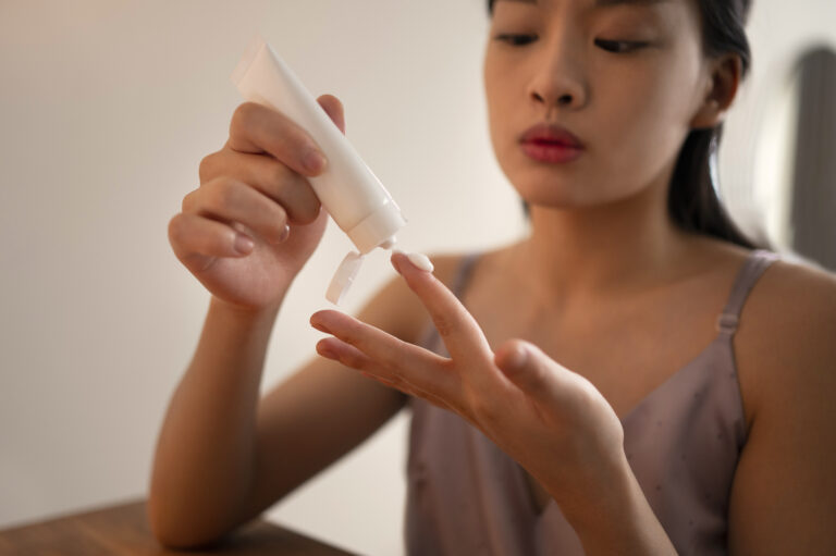Woman using Elidel cream